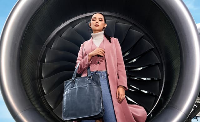 Used airline materials turning into fashion handbags