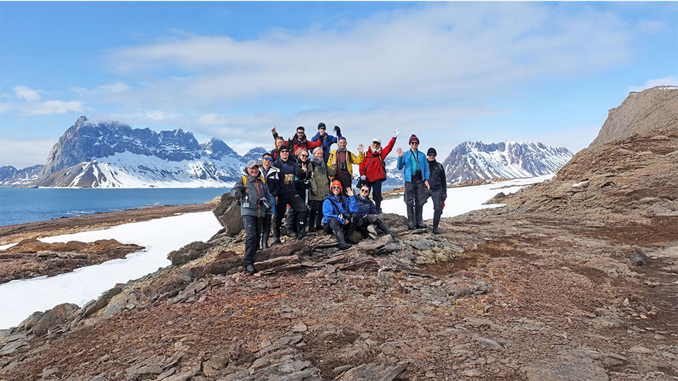 Travelers enjoying hiking and mountaineering during the expedition to the Arctic