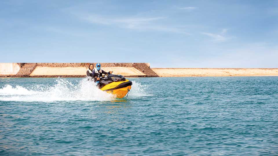 A man and woman skiing on Red Sea