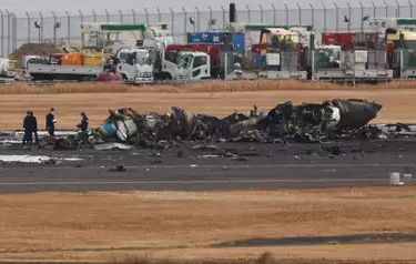 Crews begin clearing aircraft wreckage from Japan runway collision
