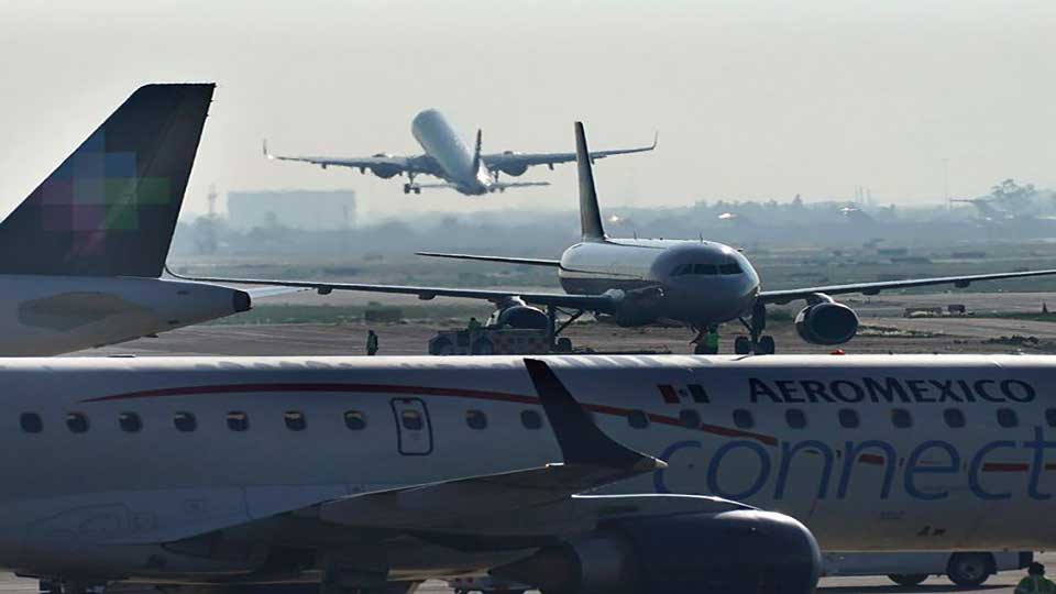 Man opens emergency exit and walks onto aircraft's wing in Mexico airport